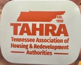 A mint box with text that reads Est. 1939, TAHARA Tennessee Association of Housing and Redevelopment Authorities